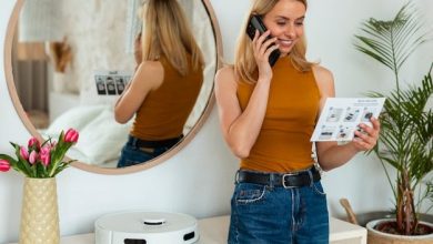 front-view-woman-with-robotic-vacuum-cleaner-home_23-2150663417-7856252