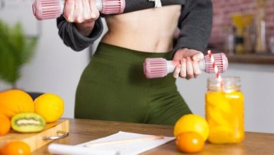 close-up-hands-holding-dumbbells_23-2148898586-8494126