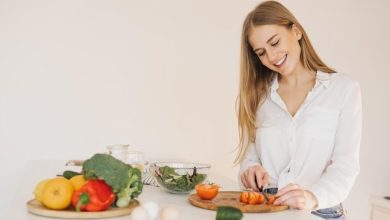 happy-cute-blonde-woman-is-preparing-salad-kitchen_1429-13286-6560978