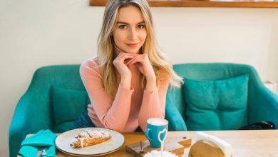 portrait-young-woman-sitting-table-with-croissant-coffee-cup_23-2148027973-8629049