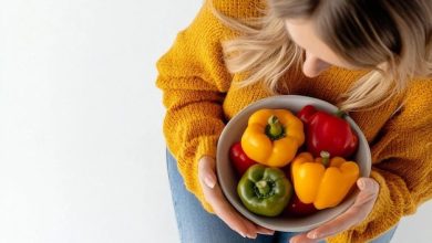 top-view-woman-holding-colored-bell-peppers-bowl-white-background_1174497-84412-6546120